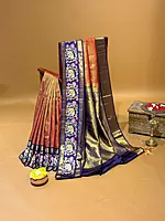 Orangish red vaira oosi checks vintage kanjeevaram saree with tanjore art