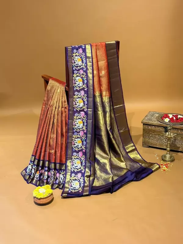 Orangish red vaira oosi checks vintage kanjeevaram saree with tanjore art