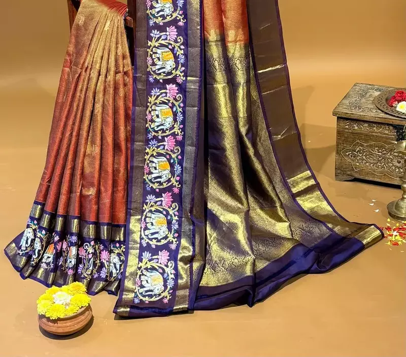 Orangish red vaira oosi checks vintage kanjeevaram saree with tanjore art