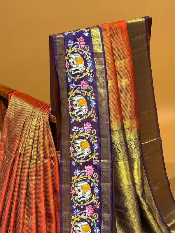 Orangish red vaira oosi checks vintage kanjeevaram saree with tanjore art